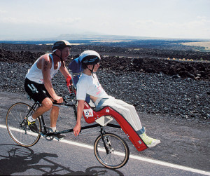 Team Hoyt cycles the Ironman in 1989