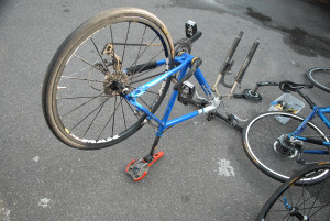 Blue bike with front wheel removed.